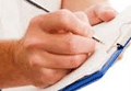 Picture of a person writing on post-op forms 