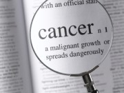 Picture of magnifying glass over the word cancer