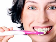 Picture of woman brushing her teeth