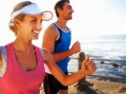 Picture of two people running on a beach to represent healthy mouth.