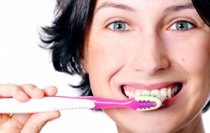 Picture of woman brushing her teeth