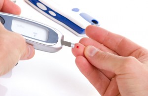 Pic of blood being taken from the finger of a diabetic that has periodontal disease.