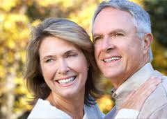 A couple showing off their new dentures